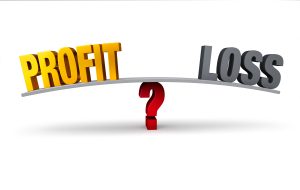 Balance scale showing profit and loss over a question mark